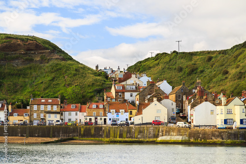 STAITHES, ENGLAND - JULY 12: View of the main seafront businesses and buildings. In Staithes, North Yorkshire, England. On 12th July 2016.