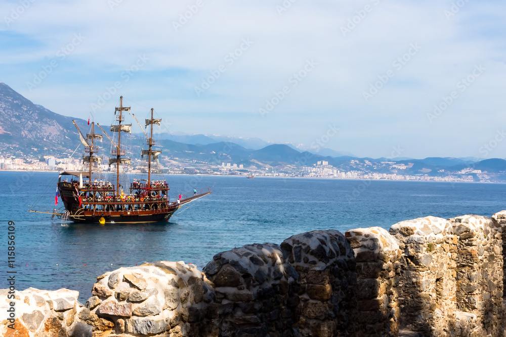 ship floating on the sea on a background of mountains ship floating on the sea on a background of mountains