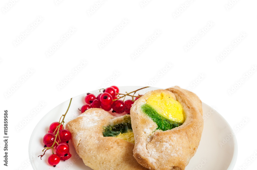 Bake isolated. Scones with jam on a plate. Pastry sprinkled with chocolate. Red currant. Bake isolated. Scones with jam on a plate. Pastry sprinkled with chocolate. Red currant.