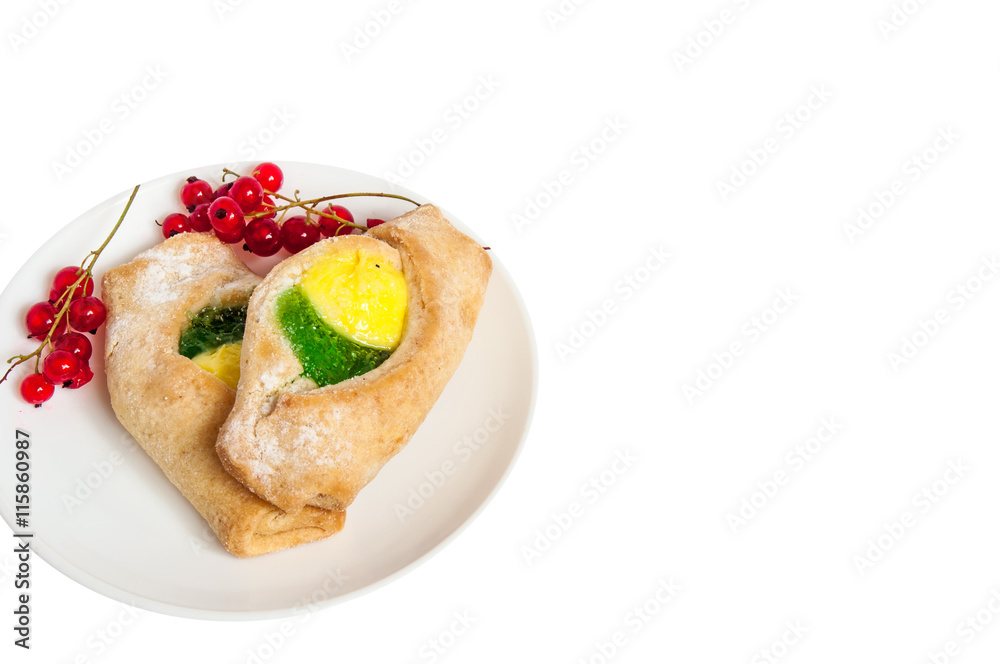 Bake isolated. Scones with jam on a plate. Pastry sprinkled with chocolate. Red currant. Bake isolated. Scones with jam on a plate. Pastry sprinkled with chocolate. Red currant.