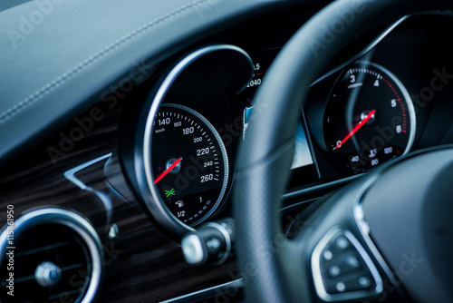 Luxury car interior details. Speedometer, steering wheell © Room 76 Photography