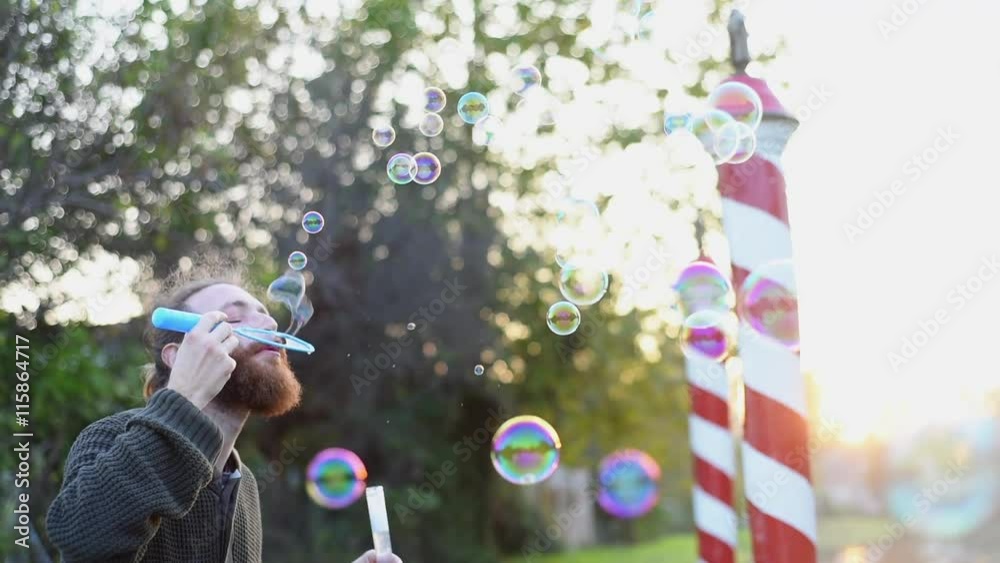 Blowing bubbles at sunset