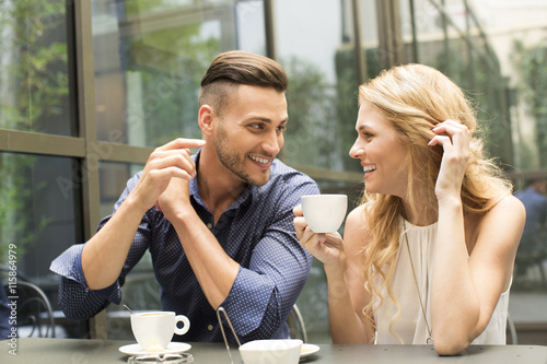 Beautiful couple having coffee on a date