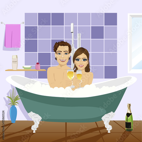 Beautiful young couple relaxing together and drinking champagne in whirlpool