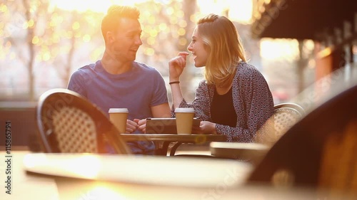 Couple in sidewalk cafe