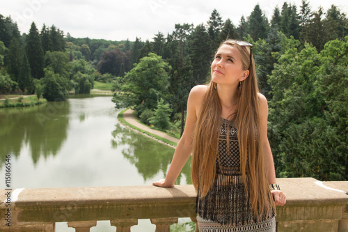 Young girl looking and panoramic scenery of park Pruhonice
