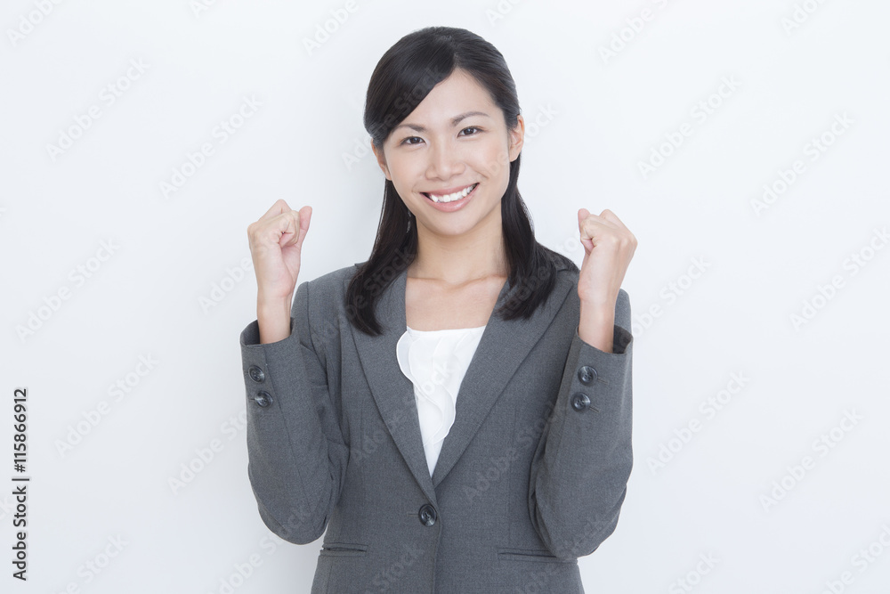 ガッツポーズする女性 ビジネスイメージ ガッツポーズする女性 ビジネスイメージ