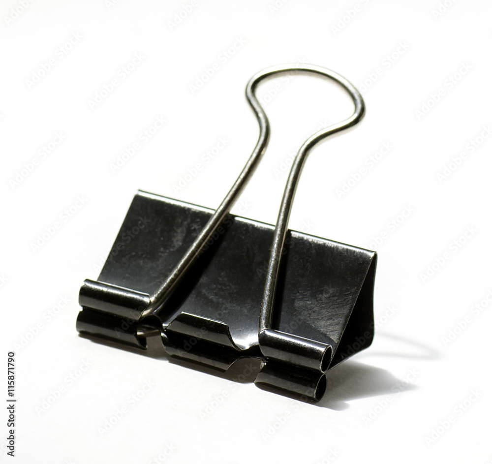 close-up on white background - paper clip black color close-up on white background - paper clip black color