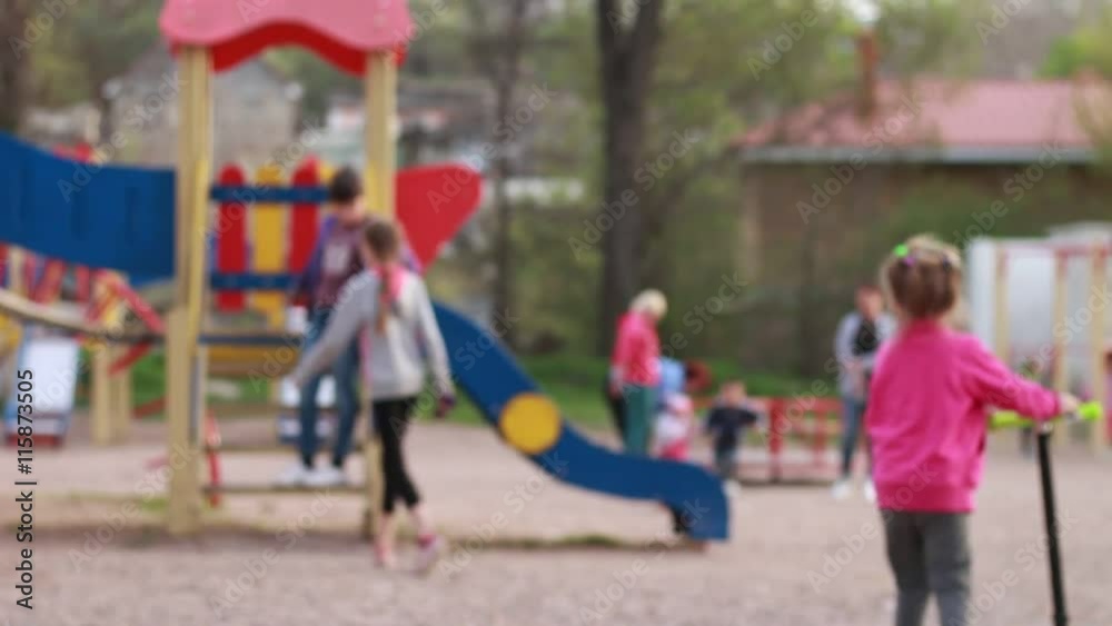 Anonymous children walking on a playground Anonymous children walking on a playground