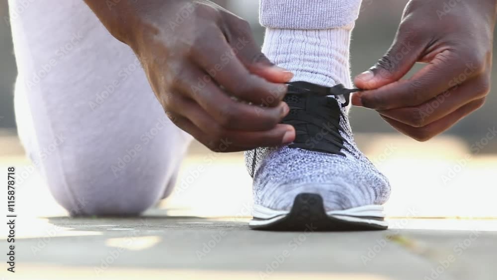 Man tying shoe