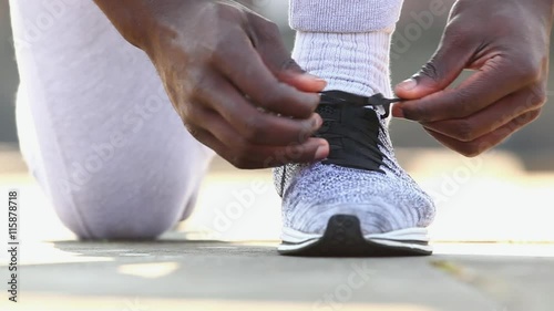 Man tying shoe