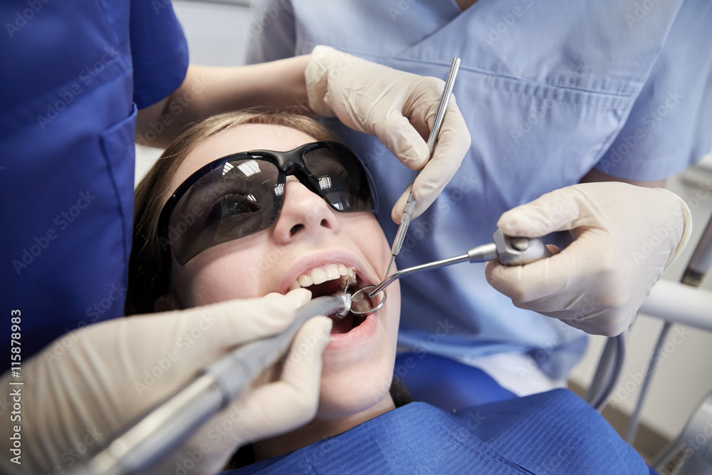 female dentists treating patient girl teeth female dentists treating patient girl teeth