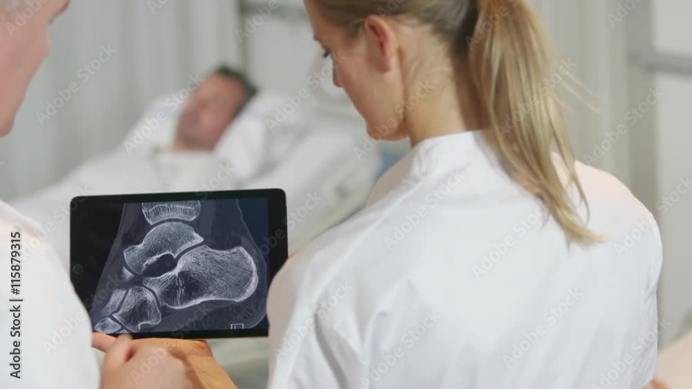 Doctors looking at x-ray image