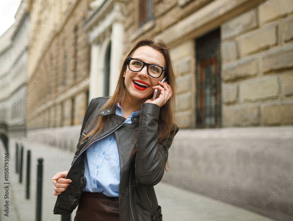 Fototapeta premium Happy smiling businesswoman talking on smart phone