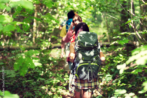 close up of friends with backpacks hiking © Syda Productions