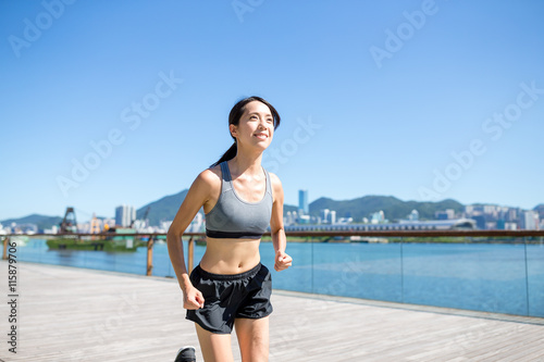 Woman running outside © leungchopan