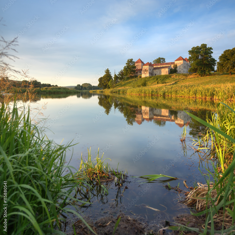 Summer evening view of old castle in Svirzh, Ukraine Summer evening view of old castle in Svirzh, Ukraine