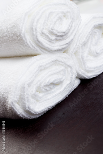 Twisted into roll white towels © Alex M