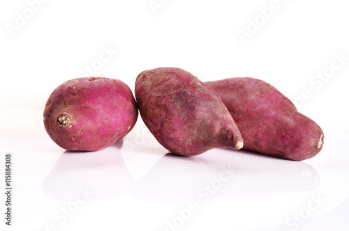 yam potatoes close up on white background