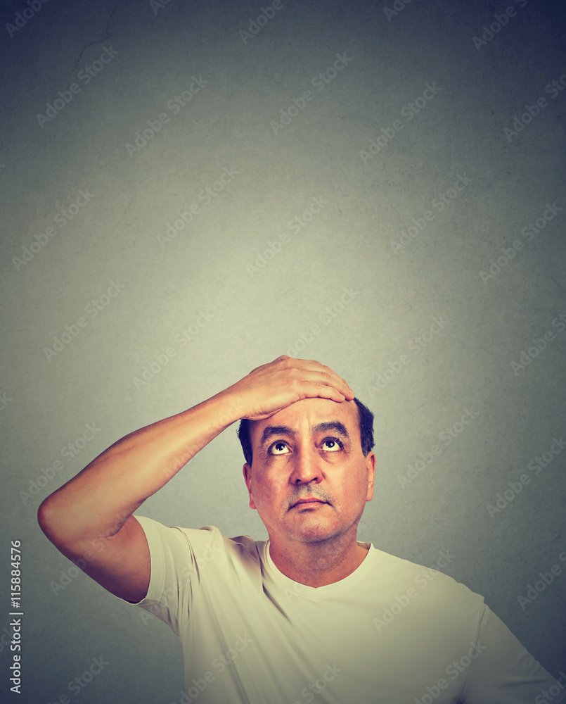 uncertain concerned middle aged man looking up uncertain concerned middle aged man looking up