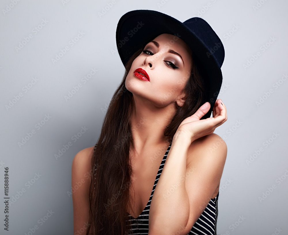 Hot sexy female model with bright makeup and red lipstick in bla Hot sexy female model with bright makeup and red lipstick in bla