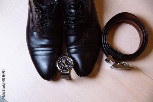 Gentleman accessory. Shoes, belt, watches