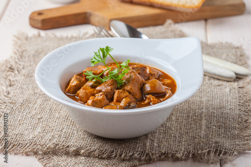 Goulash soup with pork and mushrooms.