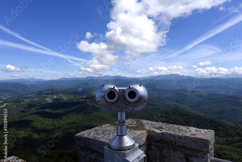 Sightseeing binoculars overlooking the clouds and mountains of Sochi, photographed from the tower of Akhun photo