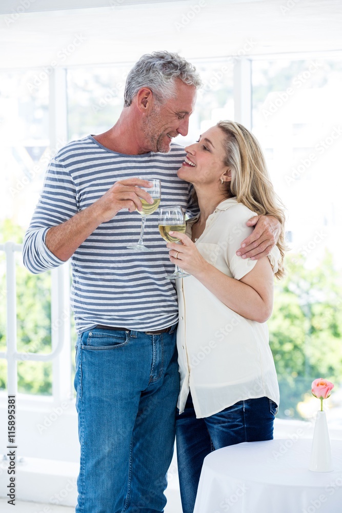 Romantic mature couple with wine glasses 