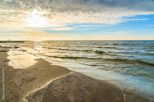 Sun shining over sea on Leba beach  Baltic Sea  Poland