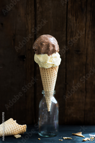 Chocolate and Vanilla Ice Cream Scoops in Waffle Cones