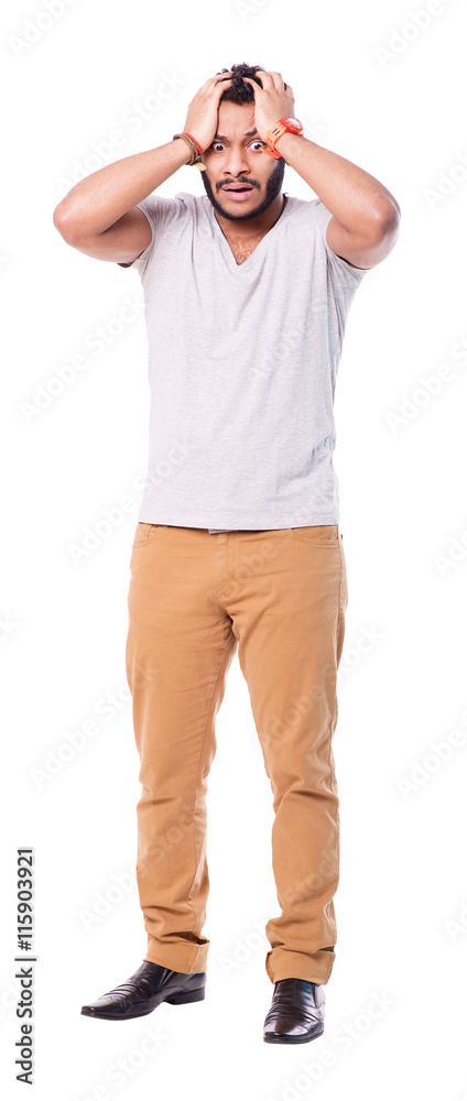 Portrait of a worried or impressionable latino man. He throws up his hands while makes a panic gesture. Full length portrait. Isolated on white background. Portrait of a worried or impressionable latino man. He throws up his hands while makes a panic gesture. Full length portrait. Isolated on white background.