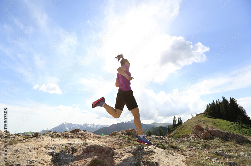 healthy young woman trail runner running on beautiful mountain peak healthy young woman trail runner running on beautiful mountain peak