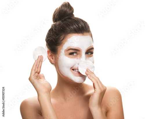 Fotografie Beautiful smiling woman with a cotton pads