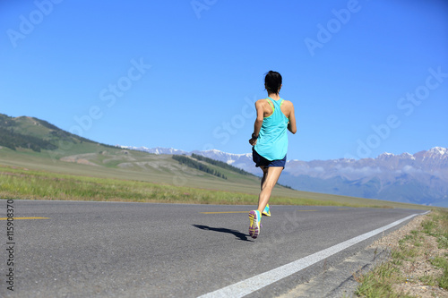 healthy lifestyle young woman runner running on trail
