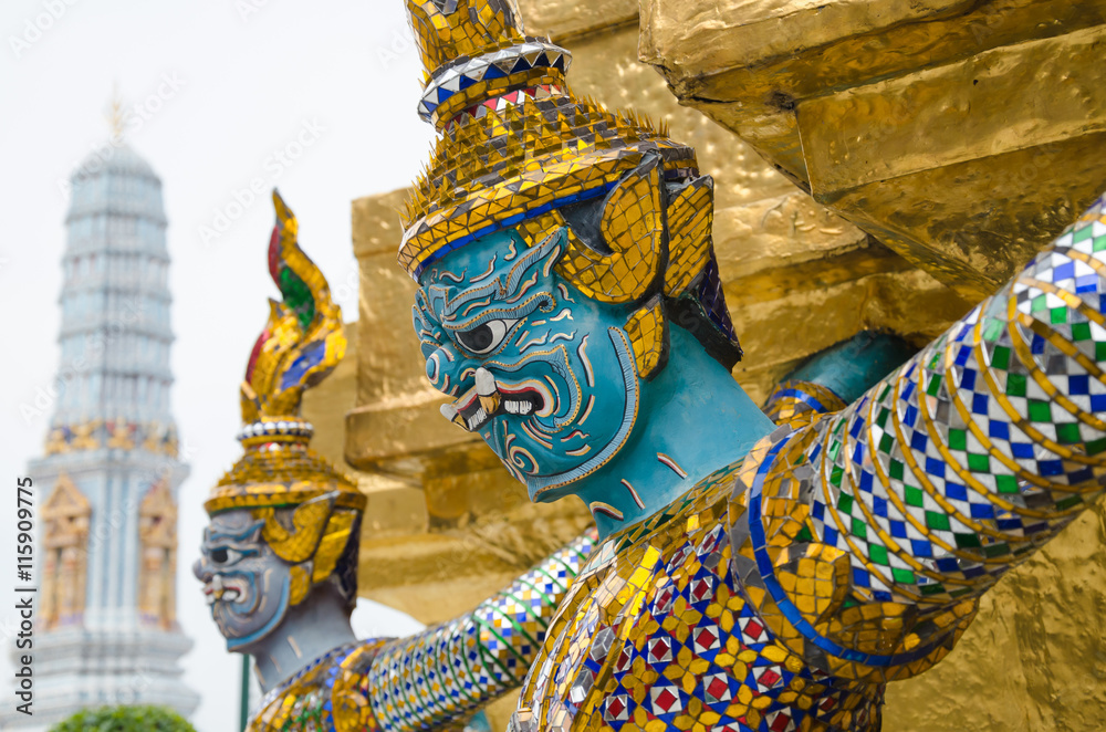 Giant Statue Surround The Basement of Grand Gold Stupa Is One of Landmark of Wat Phra Kaew Monastery, Bangkok of Thailand.