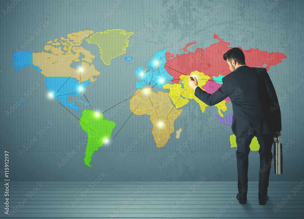 businessman drawing map on wall businessman drawing map on wall