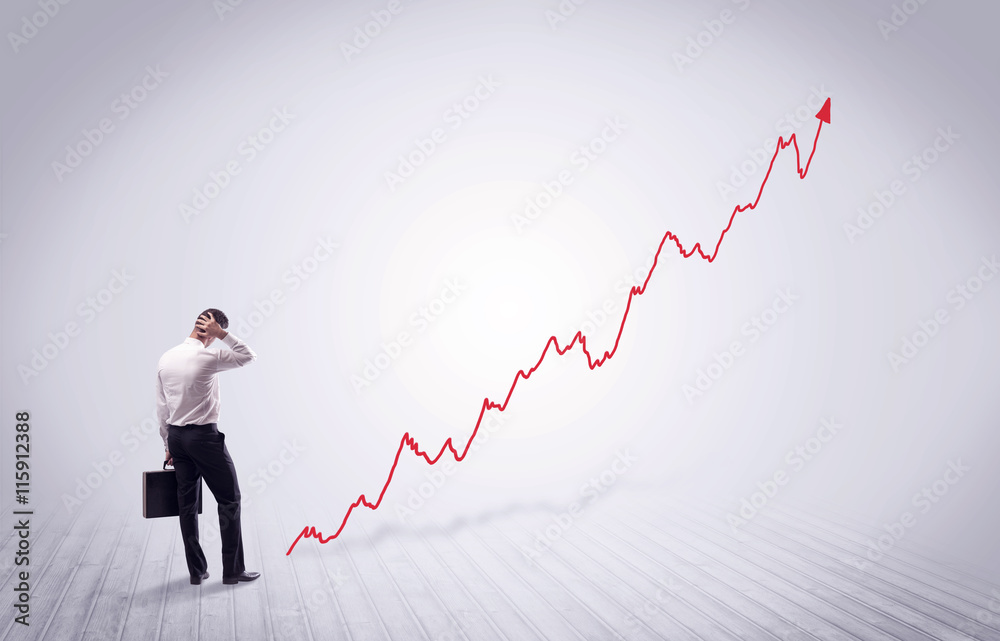 Standing businessman with red graph arrow Standing businessman with red graph arrow