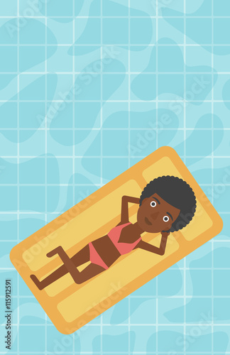 Woman relaxing in swimming pool.