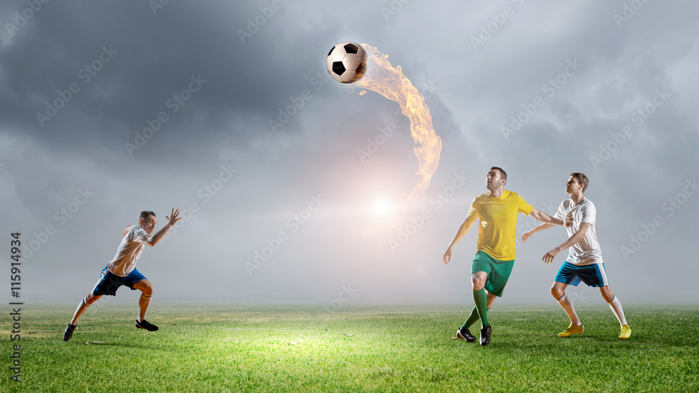 Naklejka premium Soccer players fighting for ball . Mixed media