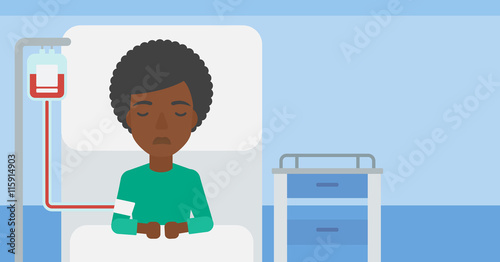 Patient lying in hospital bed.