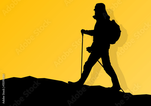Man hiking in mountains adventure nordic walking with poles in n