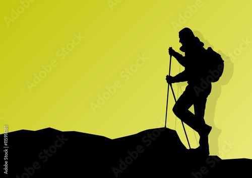 Man hiking in mountains adventure nordic walking with poles in n