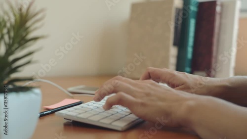 Young female secretary working at computer, answering calls in the office. Concept of multitasking and mobility.  