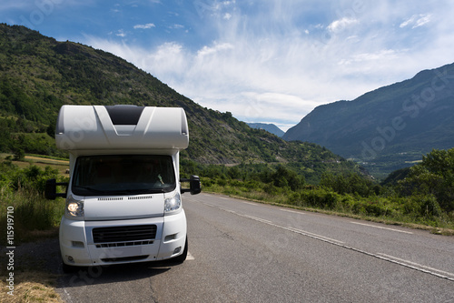 camper on the road in the French Alps 
