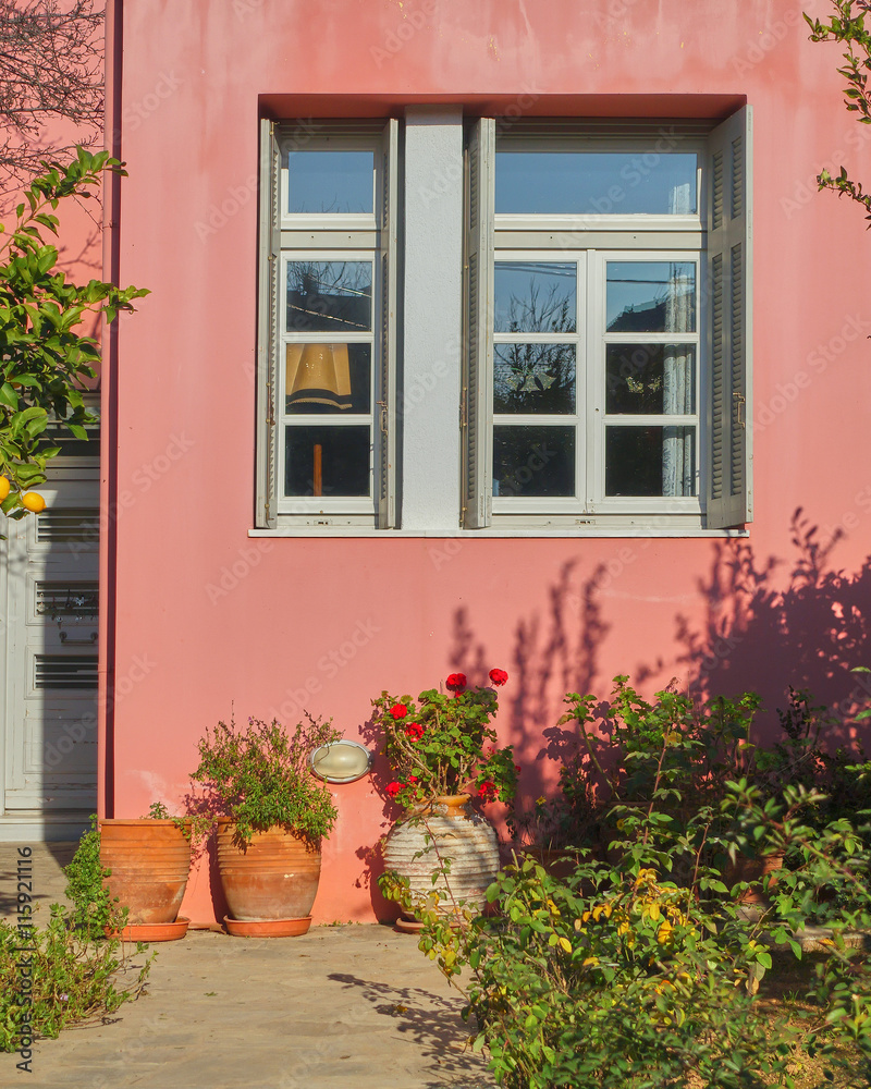 colorful house window and yard with flowers and plants, Athens Greece