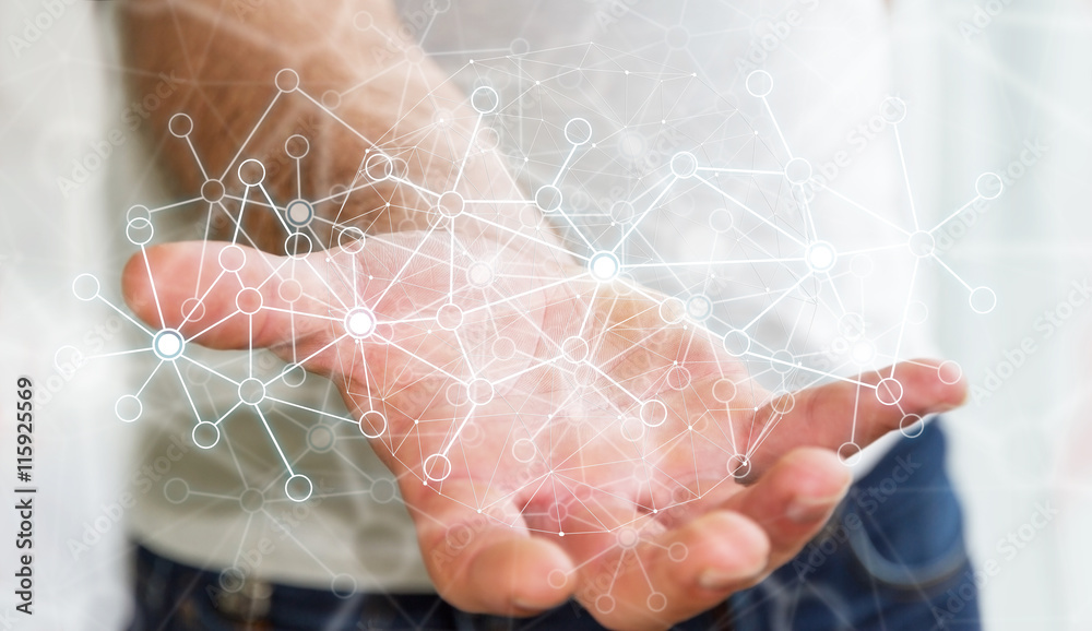 Businessman using data network with his hand Businessman using data network with his hand