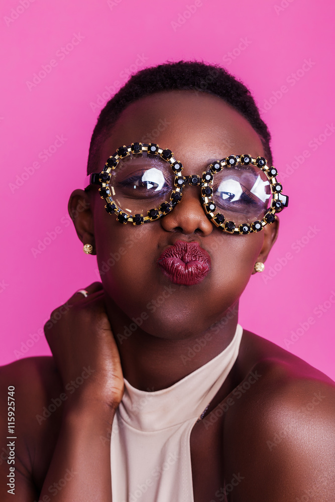 African girl kissing face while wearing funny glasses Stock Photo | Adobe  Stock