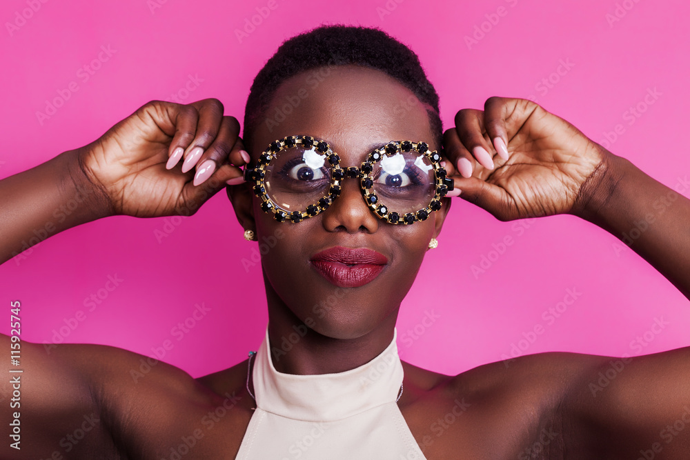 African girl portrait making funny face while wearing odd glasses Stock  Photo | Adobe Stock