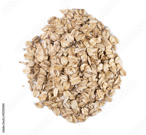 Oat flakes handful isolated on white background